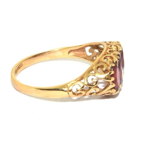 275 - 9ct gold vintage Garnet 3 stone ring in a scroll work setting size P