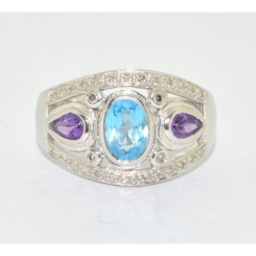 277 - 9ct white gold ladies Diamond, Amethyst and Aquamarine ring hallmarked as 0.15ct size N