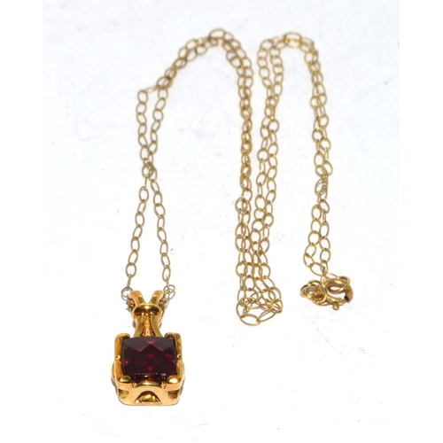 294 - 9ct gold checker cut Garnet pendant necklace on a 44cm gold chain 