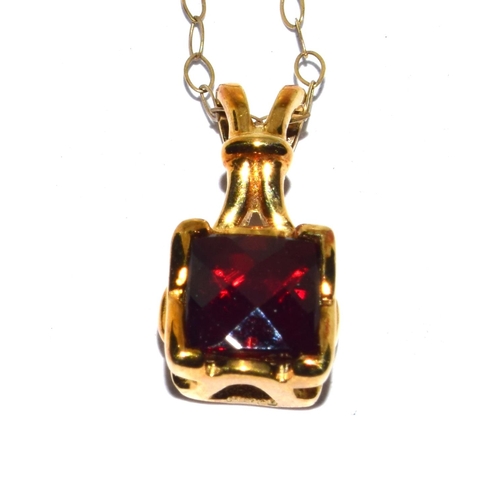 294 - 9ct gold checker cut Garnet pendant necklace on a 44cm gold chain 