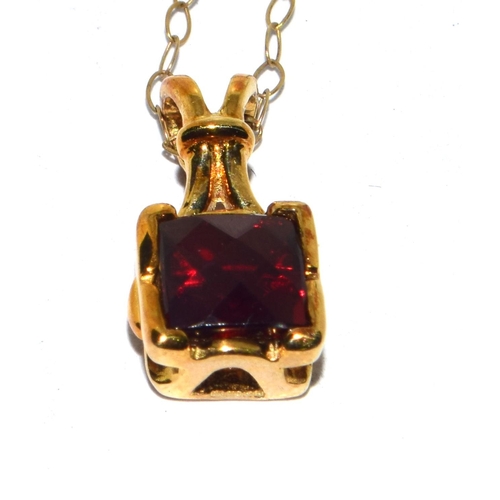 294 - 9ct gold checker cut Garnet pendant necklace on a 44cm gold chain 