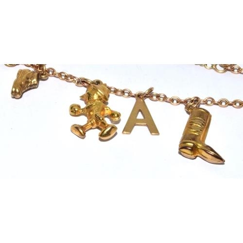 314 - 9ct gold charm bracelet with heart padlock and safety chain together with 8 charms 10.5g