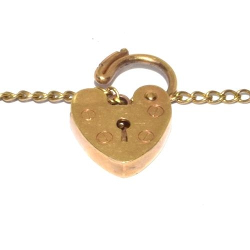 314 - 9ct gold charm bracelet with heart padlock and safety chain together with 8 charms 10.5g