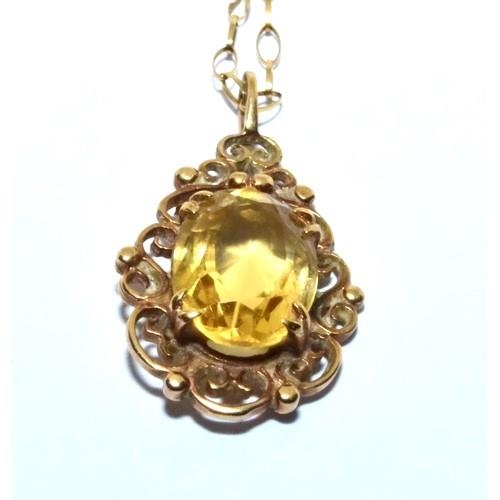 344 - 9ct gold Citrine pendant necklace in a scroll open work design on a 46cm chain