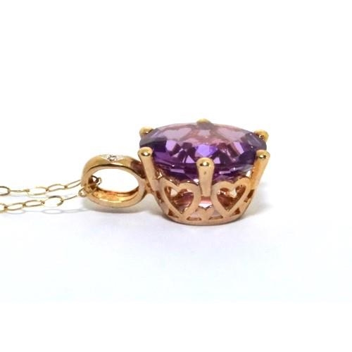 351 - 9ct gold Diamond and Amethyst pendant necklace chain is 44cm