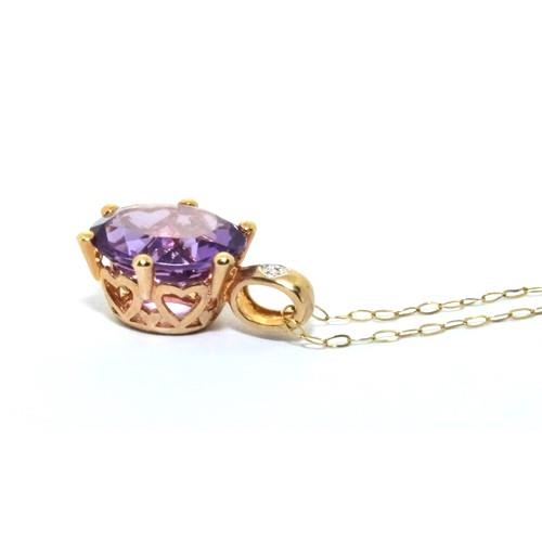 351 - 9ct gold Diamond and Amethyst pendant necklace chain is 44cm