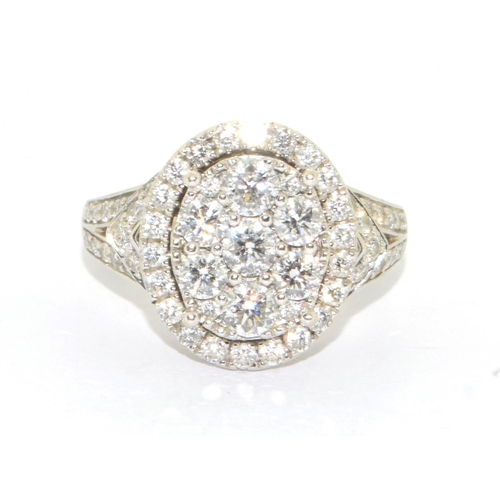 352 - 14ct white gold ladies diamond statement ring the main oval design hallowed by a ring of further dia... 