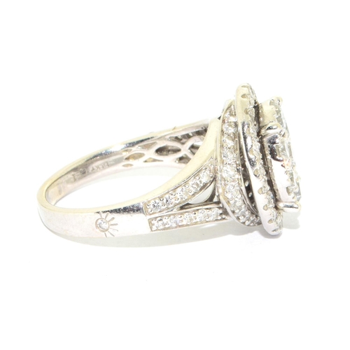 352 - 14ct white gold ladies diamond statement ring the main oval design hallowed by a ring of further dia... 