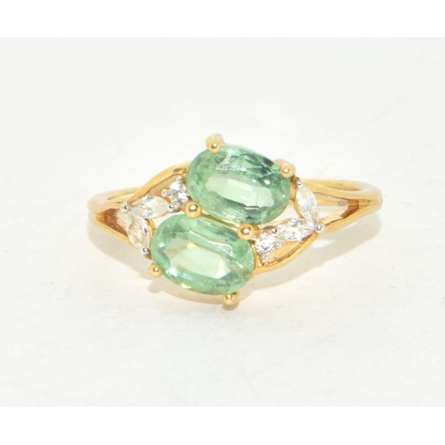 295 - 9ct gold ladies twin stone Peridot ring with clear stone decoration size N