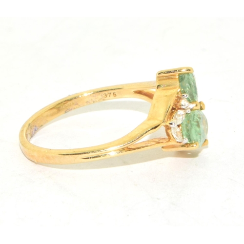 295 - 9ct gold ladies twin stone Peridot ring with clear stone decoration size N