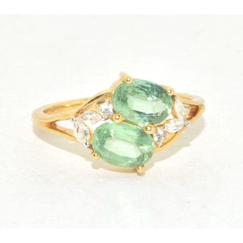 295 - 9ct gold ladies twin stone Peridot ring with clear stone decoration size N