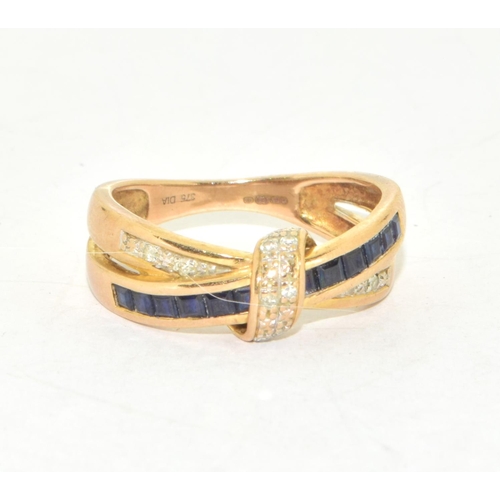 310 - 9ct gold ladies cross over Sapphire and Diamond ring hallmarked as diamond in the ring size O