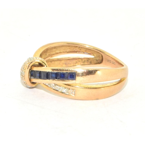 310 - 9ct gold ladies cross over Sapphire and Diamond ring hallmarked as diamond in the ring size O