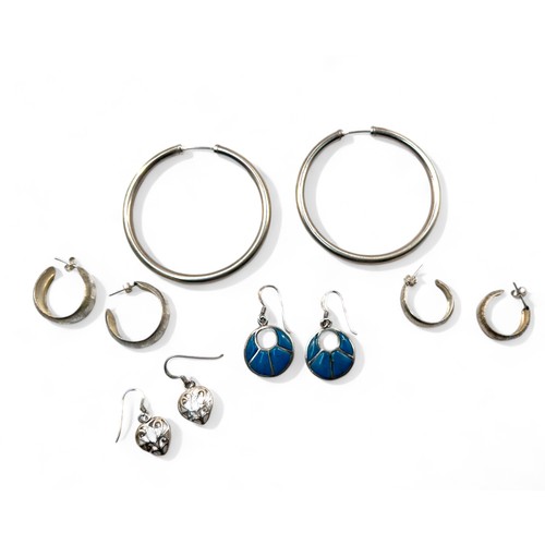 11 - A collection of five silver earrings.