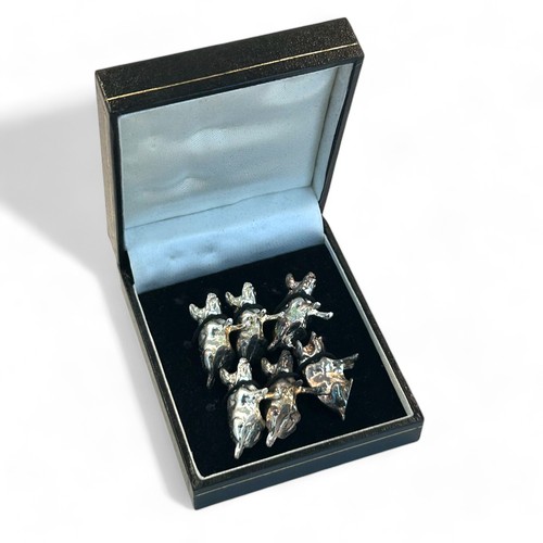 69 - A boxed set of six white metal 'Pig' place card holders.20 x 30mm