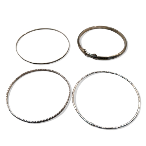 99 - Four sterling silver ladies bangles.