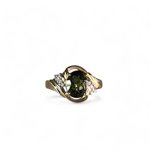 250 - A 9ct gold & Diamond ladies ring.Set with large central Teal coloured Gem.Size M.Weight - 3.2g... 