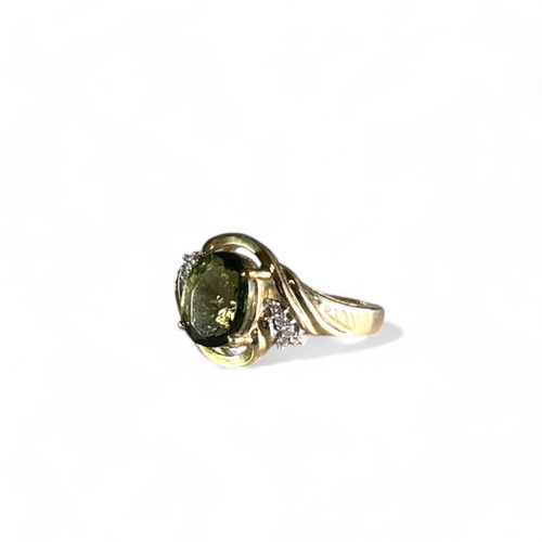 250 - A 9ct gold & Diamond ladies ring.Set with large central Teal coloured Gem.Size M.Weight - 3.2g... 