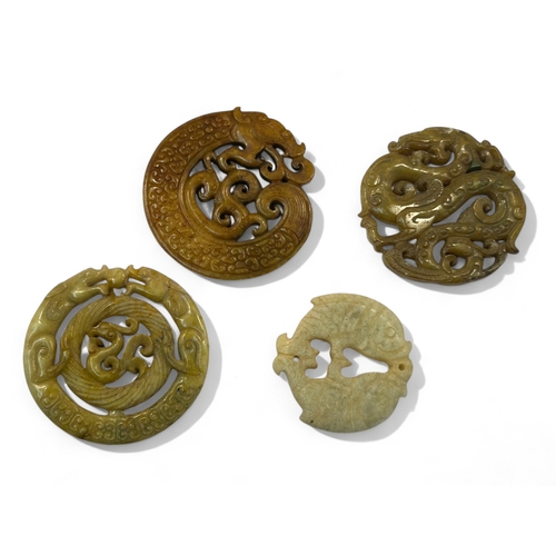 116 - A collection of four Chinese carved Bi-disc / roundels.Including C-Dragons, Phoenix, fish and more. ... 