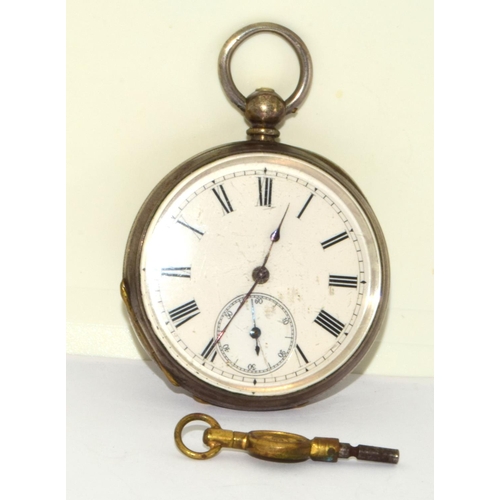 346 - Silver pocket watch and key with white face and Roman numerals and subsidiary dial seen working when... 