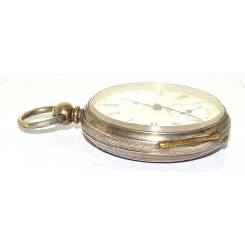 346 - Silver pocket watch and key with white face and Roman numerals and subsidiary dial seen working when... 