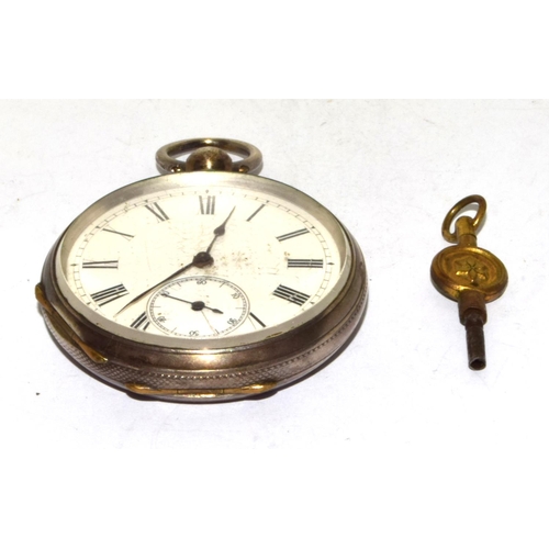 346 - Silver pocket watch and key with white face and Roman numerals and subsidiary dial seen working when... 