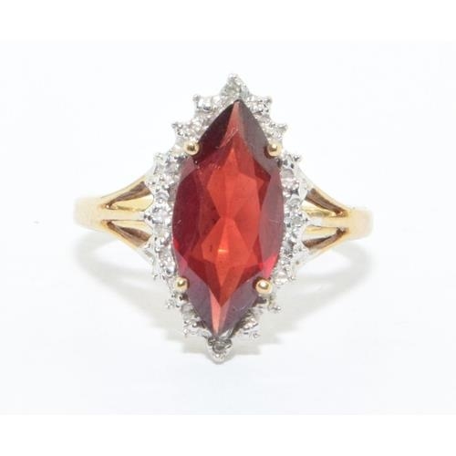 194 - 9ct gold ladies Ruby lozenge shape halo cocktail ring size N