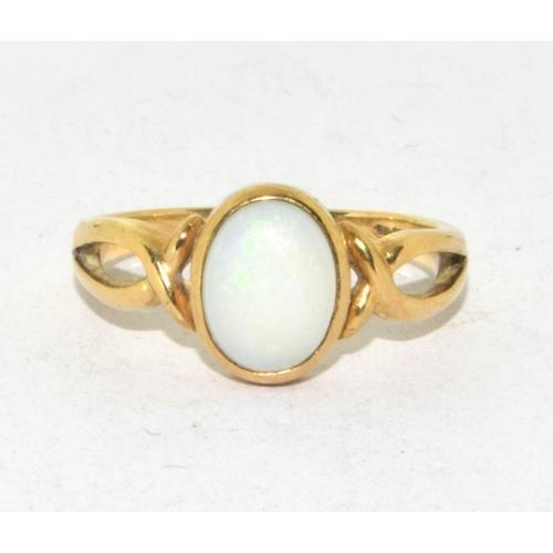 199 - 9ct gold ladies Opal solitaire ring in a cross over setting size L