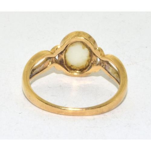 199 - 9ct gold ladies Opal solitaire ring in a cross over setting size L