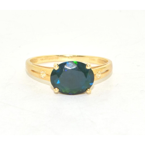 214 - 9ct gold ladies contemporary green  Diopside  solitaire ring on a twin shank with claw setting size ... 