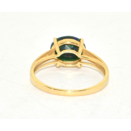 214 - 9ct gold ladies contemporary green  Diopside  solitaire ring on a twin shank with claw setting size ... 