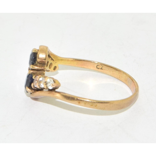 215 - 9ct gold ladies twin stone sapphire ring in a twist design with clear stone enhancement size Q