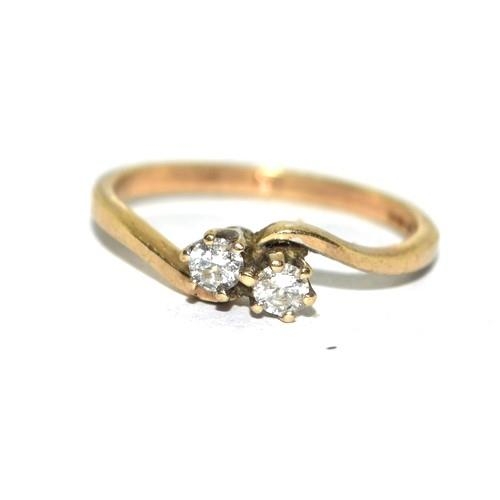 216 - 9ct gold ladies Diamond cross over  over twin stone ring approx 20pionts size O