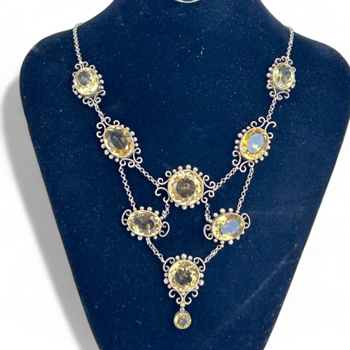 287 - Ladies antique large Citrine necklace.Set with nine large oval & round cut Citrines.