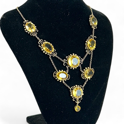 287 - Ladies antique large Citrine necklace.Set with nine large oval & round cut Citrines.