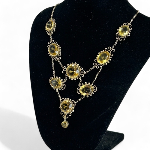 287 - Ladies antique large Citrine necklace.Set with nine large oval & round cut Citrines.