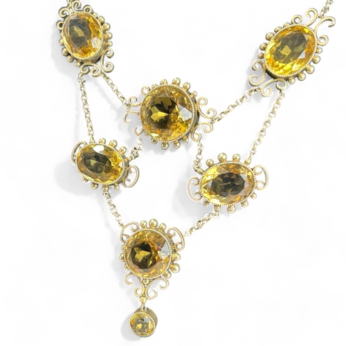 287 - Ladies antique large Citrine necklace.Set with nine large oval & round cut Citrines.