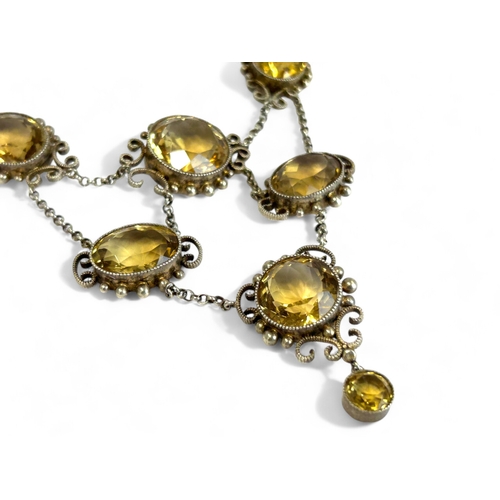 287 - Ladies antique large Citrine necklace.Set with nine large oval & round cut Citrines.