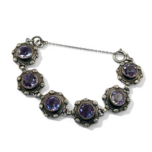 291 - A sterling silver & Amethyst bracelet.