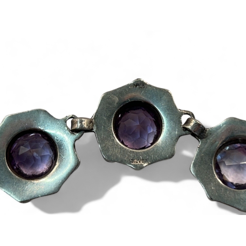 291 - A sterling silver & Amethyst bracelet.