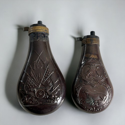 37 - A collection of four copper & brass Powder flasks. To include Colt & Philadelphia examples.