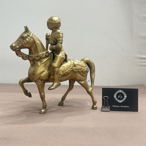 65 - Vintage brass knight on horseback figurine featuring intricate detail. Removable knight adds a dynam... 