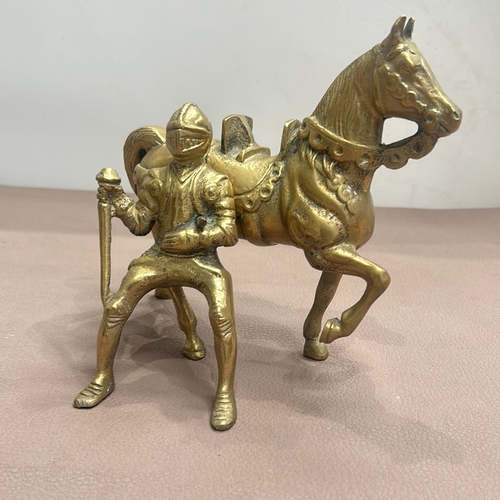 65 - Vintage brass knight on horseback figurine featuring intricate detail. Removable knight adds a dynam... 