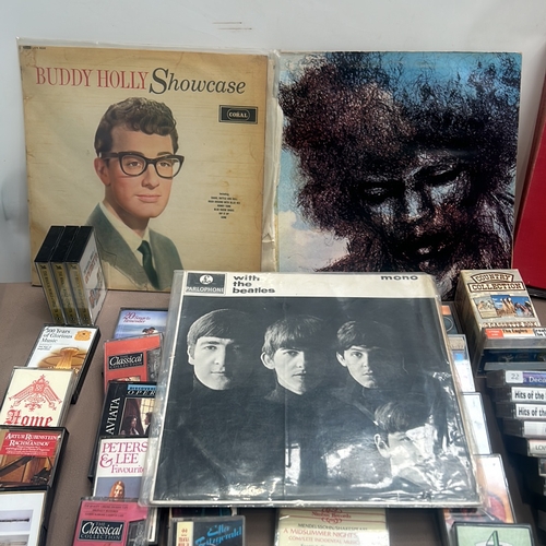 76 - Mixed lot of music items, including vinyl records by Buddy Holly, The Beatles, and JIMMY HENDRIX, pl... 