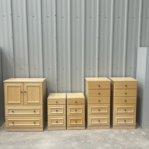 82 - Set of light wood bedroom furniture includes a Tv Cabinet, two bedside cabinets, and two chest of dr... 