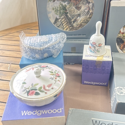 84 - Wedgwood Jasperware collection includes a lidded box, vase, collector's plates, and original packagi... 