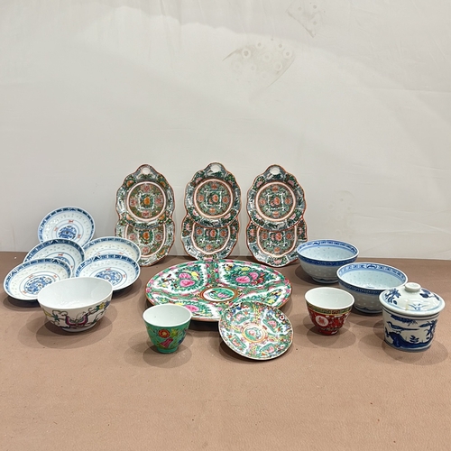 86 - Assorted Chinese porcelain dishes and bowls feature vibrant Famille Rose and blue-and-white designs.... 