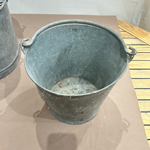 88 - Set of three vintage galvanized metal buckets, including one with a divided section and perforated i... 