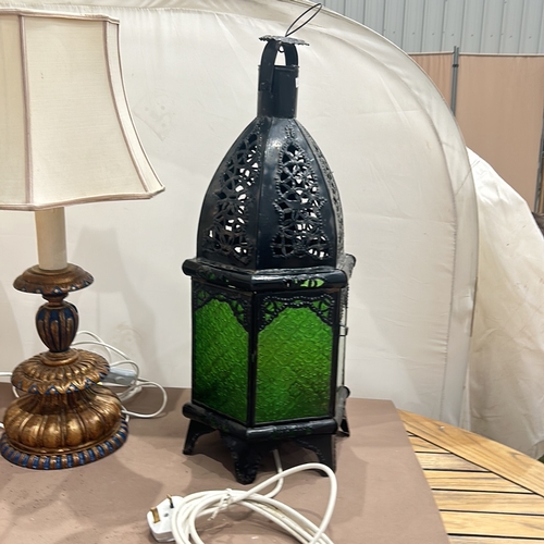 92 - Moroccan-style black metal lantern features green glass panels and intricate openwork. Vintage woode... 