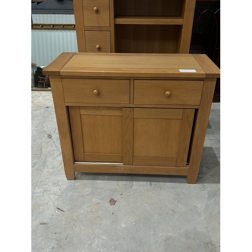 63 - A modern Con-tempo oak cabinet/ Bookshelf featuring 4 drawers and open shelves